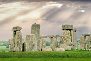 Rear view of Stonehenge, showing different heights of Sarsen stones, some with lintels.