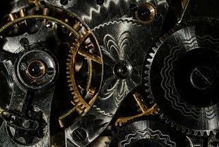 A myriad of silver and gold watch cogs