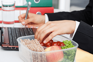 Person eating and working