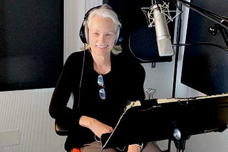 woman in a recording studio booth