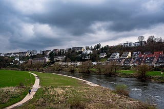 A cyclist passes on the southern Ruhr River path. Hattingen, Germany, March 18, 2024.