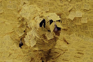 A dog covered in post it notes