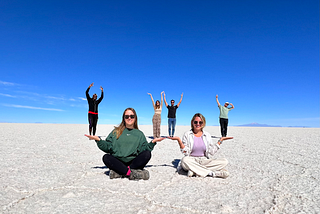 A funny perspective photo of the author and new travel friends in the Salt flats of Uyuni, Bolivia.
