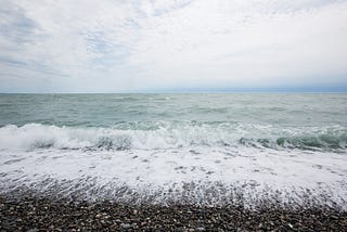 by the sea.