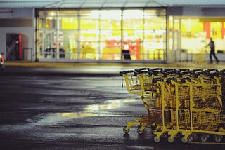 Yellow shopping carts outside a grocery store