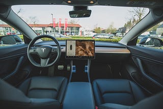 image of the interior of a tesla, a self-driven car