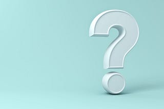 A large blocky white question mark on a pale blue background