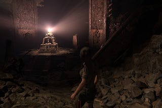 Lara Croft approaches a shiny gem she probably shouldn’t touch in Shadow of the Tomb Raider.