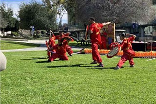 A martial arts group preforming a traditional Chinese choriography celebrating Lunar New Year