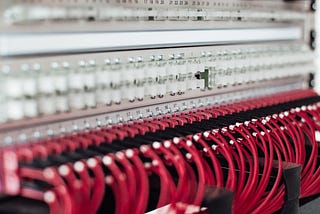 Red cables plugged into a device.