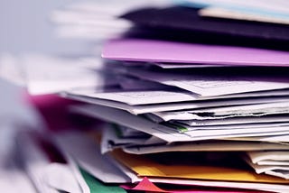 Stacks and piles of endless papers in office