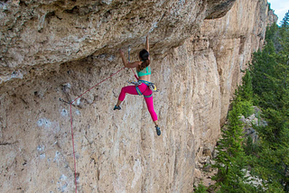 A woman climbing the mountain