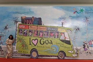Photo of the author merging into the artwork at Goa airport.