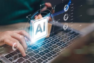 A laptop with the letters AI on it.
