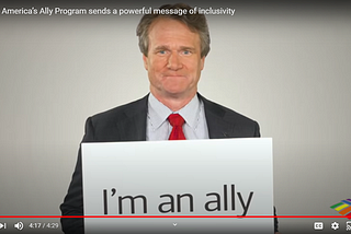 Brian Moynihan (head of Bank Of America) holds a sign stating “I’m an ally”