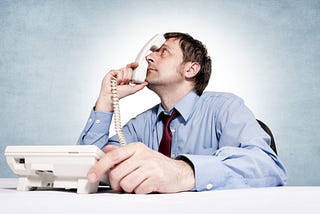A man in a frustrating phone call.