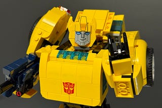 Bumblebee showing the rock on sign with his fingers.