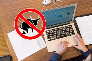 Person on computer with a no-bullshit sign