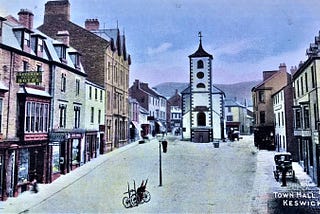 Old photograph of Keswick town centre showing the town hall, taken some time in the early 1900s.