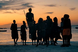 Maasai people enjoy the sunset.