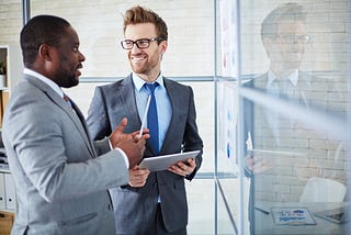 Two colleagues engage in conversation