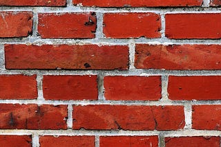 MAGA-red brick wall
