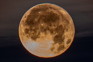 Image of a full moon against a night sky