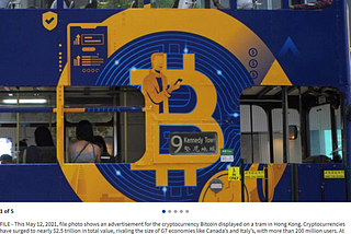 Photograph of a tram in Hong Kong with a Bitcoin advert displayed on its side.