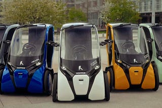 A view of the various colors available of the Hopper covered e-Trike.