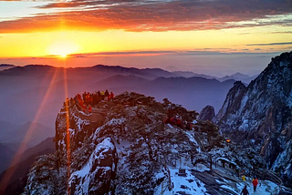 A Celestial Spectacle: Dawn at Huangshan Amidst Snow and a Sea of Clouds