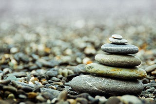 Image from Pixabay.com. A set of pebbles organized in a stack like in a zen meditation.