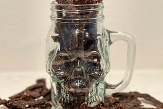 homemade black pepper jerky in a skull jar