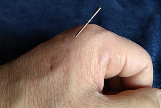 This a photo with an acupuncture needle injected into my hand. The needle is 0.16mm in diameter and 3cm long.
 The place that injected a needle is a famous acupuncture trigger point named Goukoku. It is stabbed to a depth of about 5 mm.