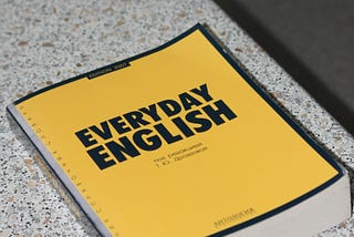 An English textbook on a bench