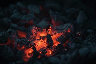 Photograph of glowing embers.