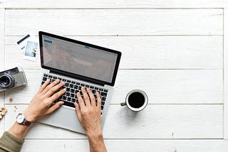 person typing on a laptop