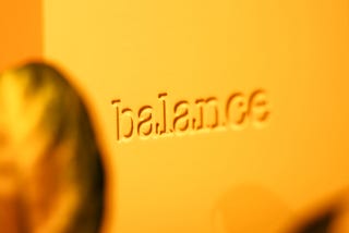The word Balance fading out of focus to the right in soft light.