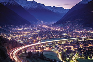 At twilight, the Rhone Valley reveals the Swiss Alps and Visp beneath a gradient sky, with a ramp hinting at train tracks leading to a welcoming home. Created by G Fildan with Midjourney on the 8th of October 2023