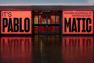 Entrance to the gallery with signage “It’s Pablo-matic: Picasso According to Hannah Gadsby”
