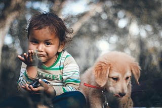 child and dog together in harmony
