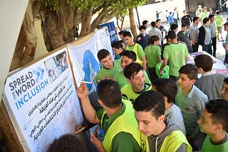 Youth signing the Spread the World- Inclusion
