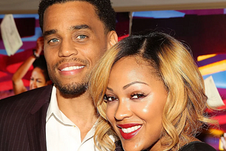Photo of actors Meagan Good and Michael Ealy posing while standing next to each other