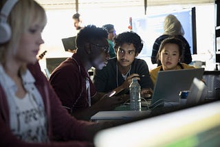 Group of people around computers