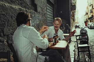 Friends having beer by the roadside.