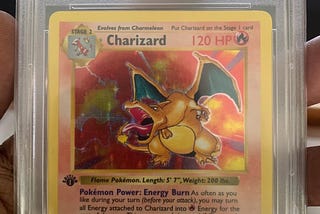 My Friend’s Charizard Card, encased and graded with score 7 | photo taken by author