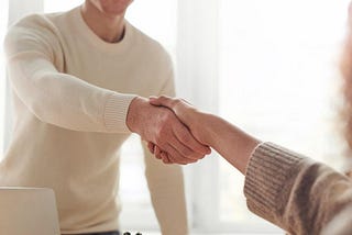 Two people shaking hands