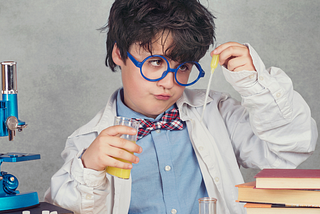 Child doing a science experiment.