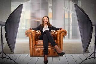 Business woman in chair for interview