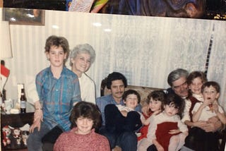 A large family seated all together.