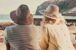 two woman talking on the beach